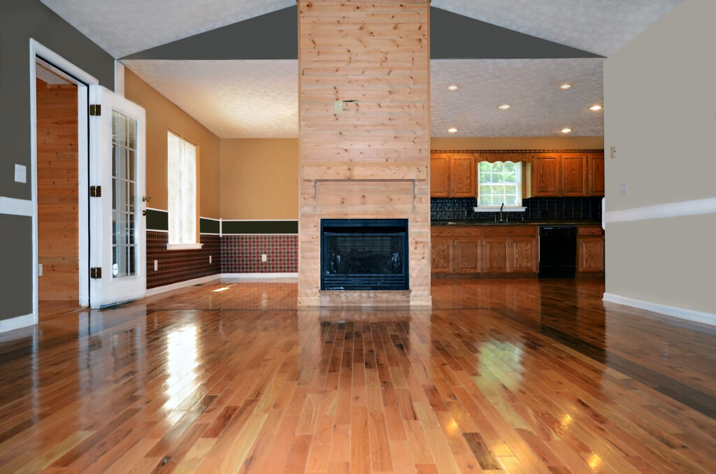 Spacious interior featuring hardwood flooring and wood fireplace by Phillips Lumber